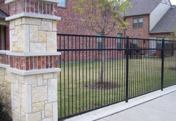 Wrought Iron Fence with Stone Columns