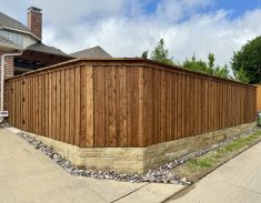 Board on Board Cedar Fence with Stone Retaining Wall