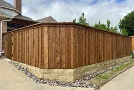 Board on Board Cedar Fence with Stone Retaining Wall