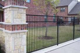 Wrought Iron Fence with Stone Columns