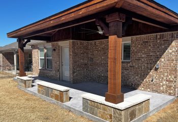 Attached Hip Patio Cover with Stone Seat wall in Carrollton, TX