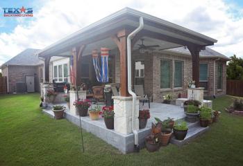 Attached Hip Patio Cover with Stone Columns and Drop Ceiling in Allen, TX
