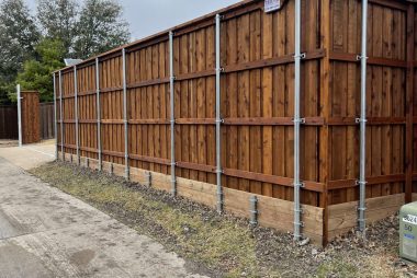 Fence retaining wall