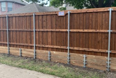 Fence retaining wall