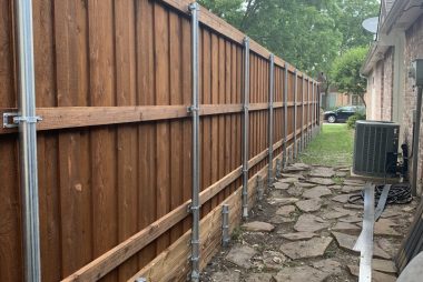 Fence retaining wall