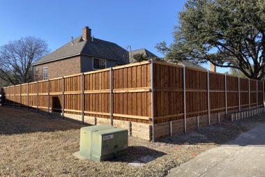 Fence retaining wall