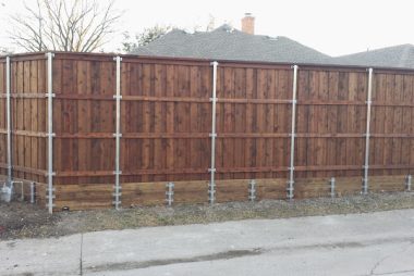 Fence retaining wall