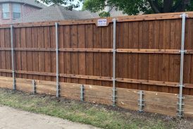 Fence retaining wall