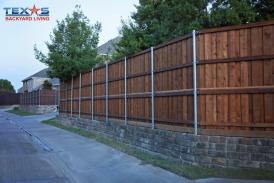 Fence retaining wall