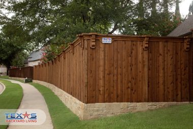 Board on Board Cedar Fence with Stone Retaining Wall in Allen, TX