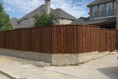 Pre-Stained Board on Board  Pre-Stained Cedar Fence with Stone Retaining Wall in  Richardson, TX