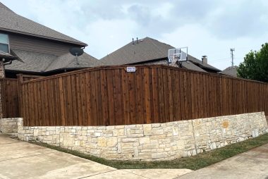 Pre-Stained Board on Board Fence with Stone Retaining Wall in Allen, TX