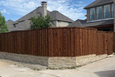 Pre-Stained Board on Board Cedar Fence  with Stone Retaining Wall in McKinney, TX