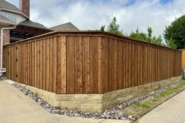 Board on Board Cedar Fence with Stone Retaining Wall in Frisco, TX